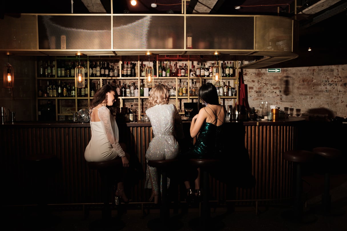 Women Sitting at a Bar